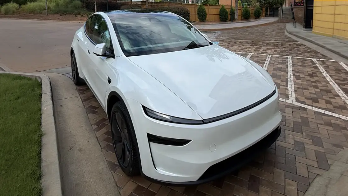 2026 Tesla Model Y Premium in Pearl White Multi-Coat — front three-quarter